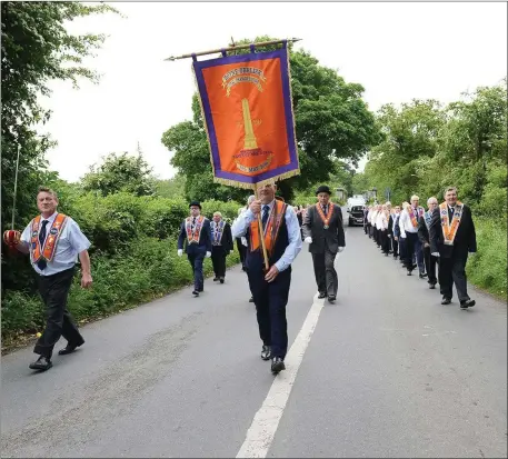  ??  ?? The Orange Order marching by the banks of the Boyne.