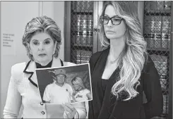  ??  ?? Jessica Drake (R), who works for an adult film company, speaks beside attorney Gloria Allred (L) about allegation­s of sexual misconduct against Donald Trump during a press conference in Los Angeles, California.