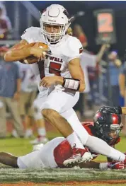  ?? STAFF PHOTO BY DOUG STRICKLAND ?? Whitwell’s Warner Ashworth carries the football past Signal Mountain’s Travion Williams during a nonregion matchup Sept. 7 at Signal Mountain. Whitwell will host South Pittsburg tonight in a big Region 3-1A game.