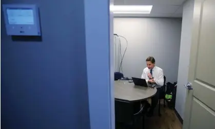  ?? Photograph: Brian Snyder/Reuters ?? Dean Phillips works in his campaign office in Manchester, New Hampshire. Phillips believes Biden is too old to mount a meaningful fight against Trump.