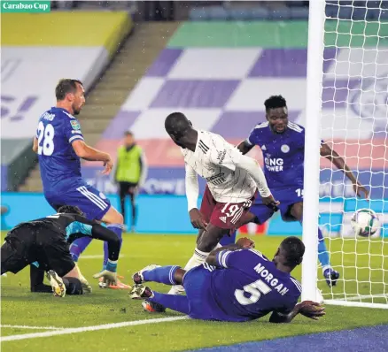  ??  ?? Carabao Cup
Agony:
Leicester City defender Christian Fuchs can only look on as his own-goal gave Arsenal the lead