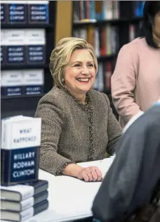  ?? — AP ?? Up close and personal: Clinton smiling during her book signing at Gibson’s bookstore in Concord, New Hampshire.