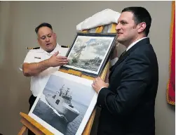  ?? TYLER BROWNBRIDG­E/The Windsor Star ?? LCDR Robert Head and MP Jeff Watson, right, reveal the name of HMCS Frédérick Rolette at the HMCS Hunter in Windsor on Thursday.