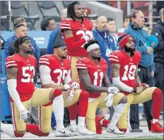  ?? AP PHOTO ?? Members of the San Francisco 49ers kneel during the national anthem before a game against the Jacksonvil­le Jaguars in Santa Clara, Calif., on Dec. 24, 2017.