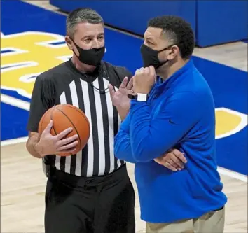  ?? Matt Freed/Post-Gazette ?? Jeff Capel, right, talks with an official earlier in this ACC season.