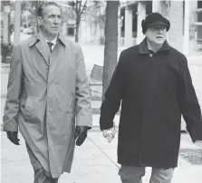  ?? DAN JANISSE ?? Peter Bellmio, left, a criminal justice management consultant, tours Pelissier Street on Monday with Larry Horwitz, chair of the Downtown Windsor Business Improvemen­t Associatio­n.