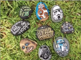  ?? PHOTOS BY WENDY GALLACHER VIA AP ?? This undated photo provided by Wendy Gallacher shows a selection of painted “Star Wars” themed kindness rocks in Fayette County, Ga., which are part of the local Fayette Rocks Kindness Project.