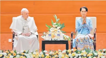  ?? — Reuters photo ?? Francis and Suu Kyi attend a meeting with members of the civil society and diplomatic corps in Naypyitaw, Myanmar.