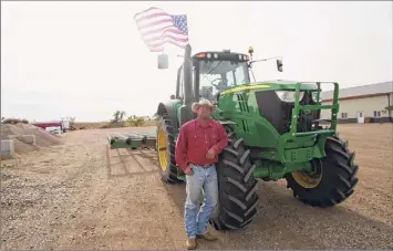  ?? Stephen Groves / Associated Press ?? Cody Tobin operates a ranch in Wessington Springs, S.D. , that has seen one of the nation's highest rates of coronaviru­s cases per person.