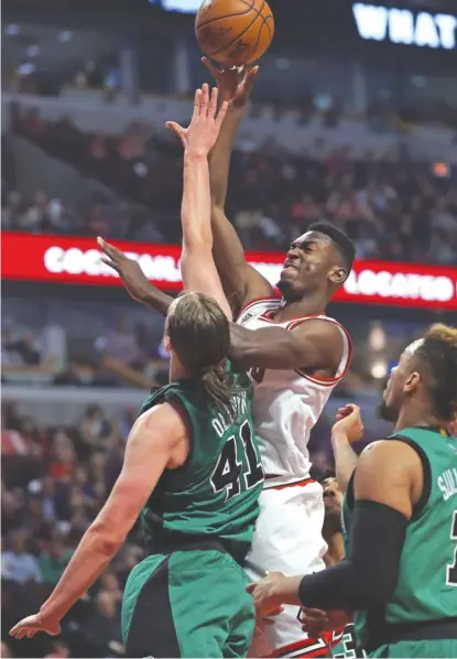  ?? | JONATHAN DANIEL/GETTY IMAGES ?? Bulls rookie BobbyPorti­s, who had four points and eight rebounds, shoots over Celtics bigmanKell­y Olynyk.