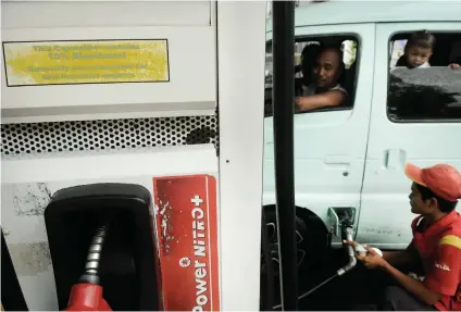  ?? SUNSTAR FILE ?? RELIEF FOR CONSUMERS. An attendant pumps fuel into a multicab tank at a gasoline station on Osmeña Blvd., Cebu City. For those reeling from the high prices of goods, Budget Secretary Benjamin Diokno’s annoucemen­t that the hike in fuel excise taxes for 2019 will be suspended is a welcome developmen­t. The suspension, however, will be subject to a quarterly assessment.