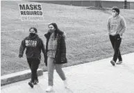  ?? ULYSSES MUÑOZ/BALTIMORE SUN ?? Signs remind students in January that masks are required on the Loyola University Maryland campus, which is one of the schools that decided to allow some in-person learning after being closed in the fall.