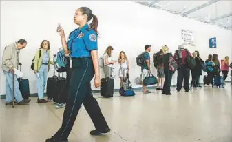  ?? Robert Gauthier ?? LINES such as this at an LAX screening point and long wait times have become common at airports.