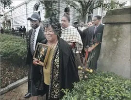  ?? Photograph­s by Grace Beahm Alford Charleston Post and Courier ?? JUDY AND WALTER Scott Sr., whose son Walter Scott was killed during a traffic stop in North Charleston, S.C., in 2015, leave court after the sentencing.