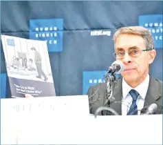  ?? — AFP photo ?? Roth holds a copy of a report into sexual abuse against women in North Korea, as he attends a press conference in Seoul.