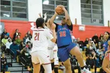  ?? TERRANCE WILLIAMS/FOR CAPITAL GAZETTE ?? Old Mill’s Amani Watts attempts a shot against two Glen Burnie defenders during the first half of a game on Dec. 9. Watts scored her 1,000th career point last week, a testament to her persistenc­e and growth.
