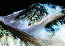  ?? NASA/REUTERS ?? Dark streaks hundreds of metres long have been discovered on Mars and are believed to be flowing, briny water that dries up during Martian winter.