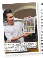  ??  ?? Sharma holds up a copy of tabloid! featuring Salman Khan on the cover.