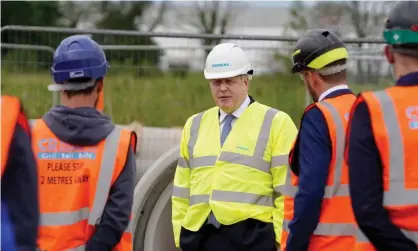  ??  ?? Boris Johnson on a visit this week to the Siemens rail factory constructi­on site in Goole, East Yorkshire. Photograph: Andrew Parsons/No 10 Downing Street handout/EPA