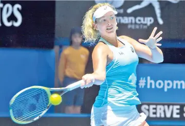  ?? — AFP photo ?? Coco Vandeweghe of the US hits a return against Anastasia Pavlyuchen­kova of Russia during their first session women’s singles match on day one of the Hopman Cup tennis tournament in Perth on December 30, 2017.