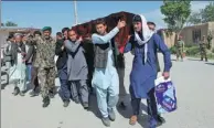  ?? REUTERS ?? Relatives carry the coffin of one of the victims a day after an attack on the Afghan army’s Corps 209 Shaheen base in northern Balkh province, on Saturday.