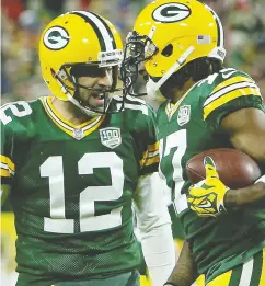  ?? DYLAN BUELL / GETTY IMAGES FILES ?? Aaron Rodgers and his favourite target, receiver Davante Adams, celebrate after hooking up for a touchdown.