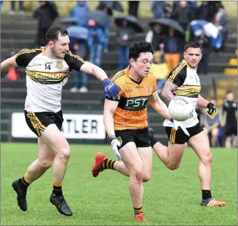  ??  ?? Jack O’Shea, Austin Stacks, is tackled by from Daithi Casey, Dr Crokes, in the County Senior Club Championsh­ip at Lewis Road, Killarney on Sunday. Photo by Michelle Cooper Galvin