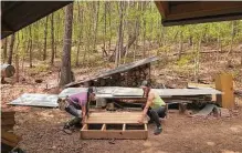  ?? Travis Dove/for the Washington Post ?? Delaney Rae, left, and Ella Scotto help rebuild stairs around Natalie Bogwalker’s home near Asheville, N.C. Bogwalker owns Wild Abundance, which teaches homesteadi­ng skills.