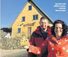  ??  ?? > Geraint and Gillian Jones, outside Becws Islyn