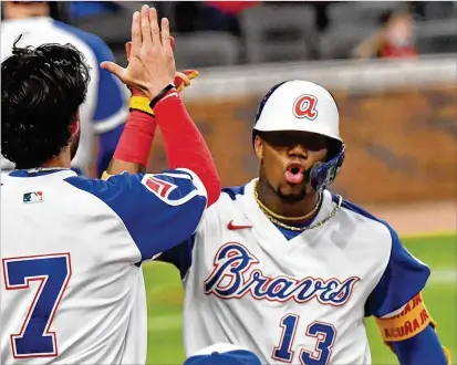  ?? HYOSUB SHIN/HYOSUB.SHIN@AJC.COM ?? Ronald Acuna Jr. on Sunday night went 3-for-4 — infield single, another single, a sac fly and another massive home run — that led his manager to say: “He’s showed all five tools since we’ve started play.”