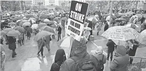  ?? ROBERT HANASHIRO/USA TODAY ?? Thousands of teachers and supporters gather for a rally at Grand Park in downtown Los Angeles on Monday. During the strike, students with special needs are being placed in unfamiliar situations.