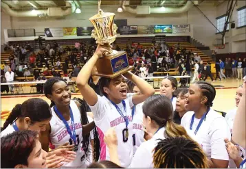  ?? PHOTO BY ANDY HOLZMAN ?? Birmingham celebrates with the trophy after beating Westcheste­r for the L.A. City Section Open Division title Saturday.