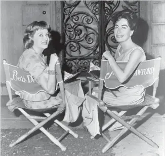  ?? Warner Bros. / Getty Images ?? DAVIS and Crawford keep their venom in check on the “Whatever Happened to Baby Jane?” set.