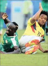  ?? Isithombe: REUTERS ?? INJINI yeSenegal uSadio Mane uzame wancama nozakwabo ukuthi bajike izinto emdlalweni wabo neColombia okuyiyo egcine idlulele kuLast 16 ye-2018 Fifa World Cup