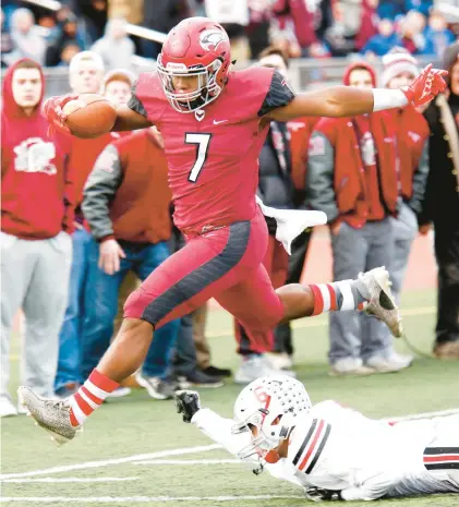  ?? LOU RABITO/SPECIAL TO THE MORNING CALL ?? St. Joseph’s Prep’s D’Andre Swift leaps over Parkland’s Juan Salas-Negron during a PIAA Class 6A state quarterfin­al in 2016. St. Joe’s Prep went on to win, 38-17. The teams will meet again Saturday in the 6A quarterfin­als at Bethlehem Area School District quarterfin­als.