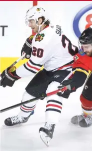  ?? | AP, GETTY IMAGES ?? Patrick Sharp ( from left), Ryan Hartman and Brandon Saad will play together on the fourth line in coach Joel Quennevill­e’s latest lineup shuffle.