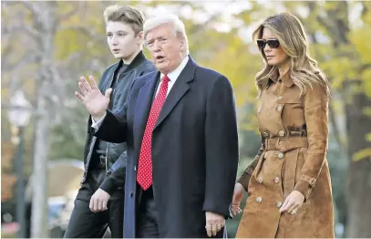  ?? Picture: AFP ?? FAMILY MATTERS. US President Donald Trump, Melania Trump and their son Barron walk across the South Lawn before leaving the White House on board Marine One last month.