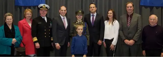  ??  ?? Lieutenant Kirsty Moran and her family with Vice-Admiral Mark Mellett, Minister Paul Kehoe and An Taoiseach Leo Varadkar.