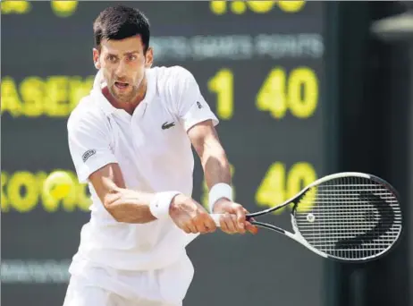  ?? GETTY IMAGES ?? Novak Djokovic plays a backhand during his Wimbledon second round match against Adam Pavlasek in London on Thursday.