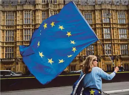  ?? EPA PIC ?? A pro-EU protester demonstrat­ing against the government’s Repeal Bill outside parliament in London on Monday.