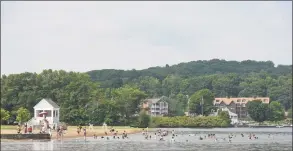  ?? H John Voorhees III / Hearst Connecticu­t Media file photo ?? Swimmers enjoy the cool waters of Candlewood Lake at Danbury Town Park on July 4th, 2018.