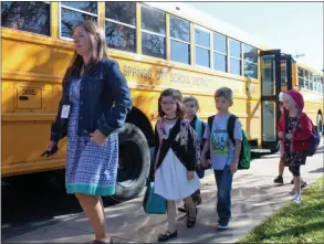  ?? LAUREN HALLIGAN - MEDIANEWS GROUP ?? Division Street Elementary School students walk from their bus into the school on Thursday morning for their first day of the 2019-2020 school year.