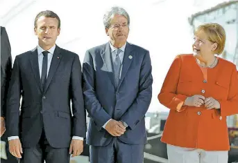  ?? AP ?? Macron, Gentiloni y Merkel. Francia, Italia y Alemania representa­dos en una cumbre de la UE.