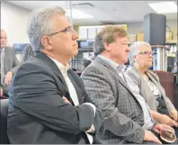  ?? RYAN ROSS/THE GUARDIAN ?? Environmen­t Minister Richard Brown, left, waits with Charlottet­own Mayor Clifford Lee and Transporta­tion Minister Paula Biggar during a news conference at Holland College Friday announcing details of P.E.I.’s climate change action plan.