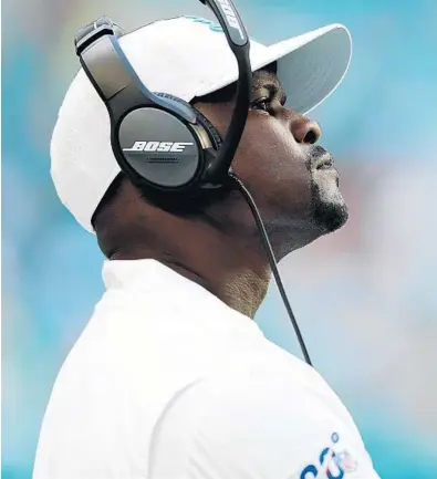  ?? BRYNN ANDERSON/AP ?? Dolphins head coach Brian Flores wears a look of frustratio­n Sunday as he looks toward the field, where the Ravens rolled over Miami.