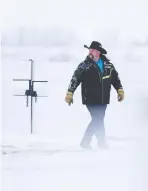  ??  ?? Craig Thoms, the bison manager for Wanuskewin Heritage Park, walks through the park following the release of the plains bison from Grasslands National Park. Thoms was heavily involved in bringing in additional animals from a South Dakota rancher who had bulls from the herd in Yellowston­e National Park.