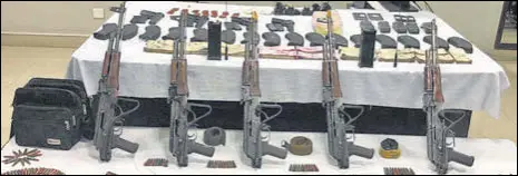  ?? HT PHOTOS ?? Five AK-47 rifles, along with 16 magazines and 472 rounds; four China-made 30-bore pistols, along with eight magazines and 72 rounds; nine hand grenades; five Thuraya satellite phones, along with their ancillary equipment, two mobile phones, two wireless sets and ₹10 lakh in fake Indian currency were recovered from the accused.