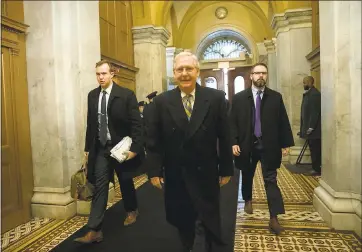  ?? J. SCOTT APPLEWHITE — ASSOCIATED PRESS ?? Senate Majority Leader Mitch McConnell, R-Ky., arrives at the Capitol in Washington on Friday, where a late-night vote on a stopgap funding measure to keep the government open failed.