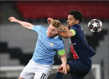  ?? AFP ?? City’s Belgian midfielder Kevin De Bruyne (left) fights for the ball with PSG’s Brazilian defender Marquinhos during the UEFA Champions League first leg semi-final football match on Wednesday.