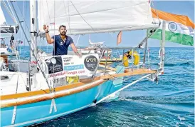  ??  ?? In this file photo, India’s Abhilash Tomy gestures on his boat “Thuriya” as he sets off from Les Sables d’Olonne Harbour at the start of the solo around-the-world “Golden Globe Race” ocean race in which sailors compete without high technology aides. — AFP